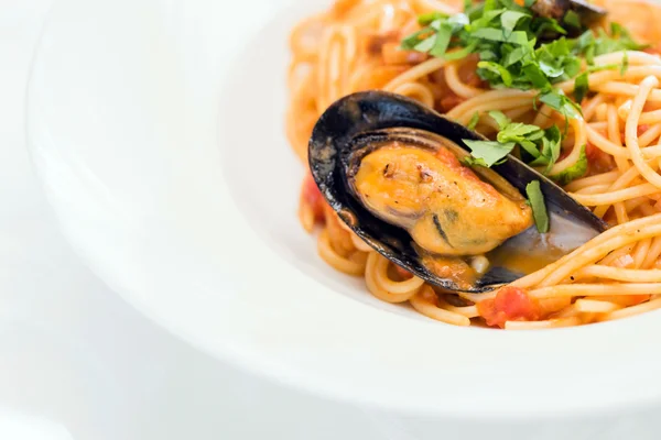 Pasta with mussels on plate — Stock Photo, Image