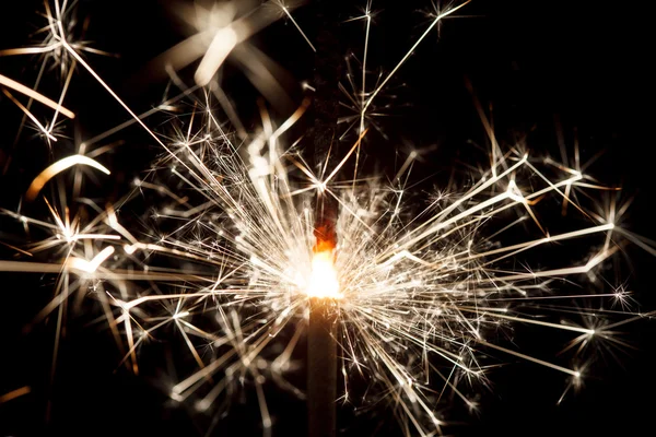 Bright sparkler on black — Stock Photo, Image