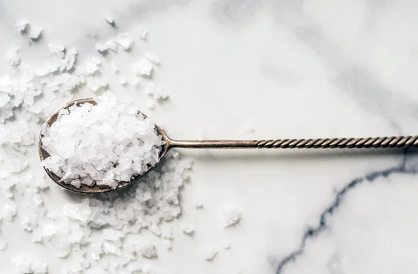 Sea salt on spoon — Stock Photo, Image