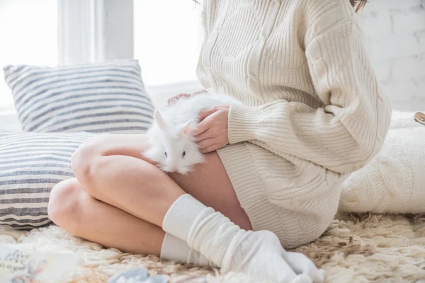 Woman sitting with rabbit — Stock Photo, Image