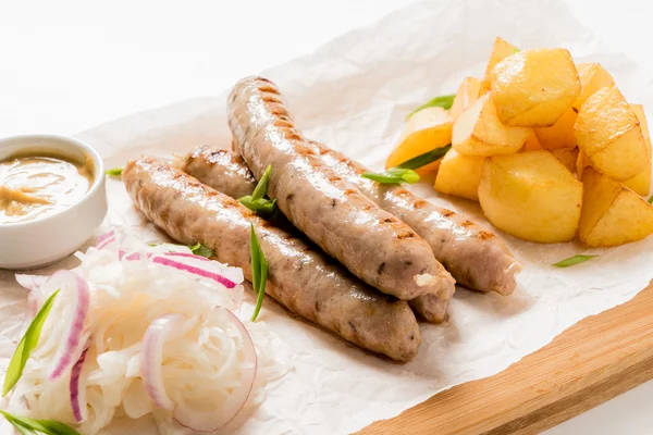 Roast sausages with potatoes — Stock Photo, Image