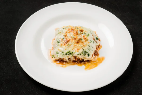 Fresh lasagna on plate — Stock Photo, Image