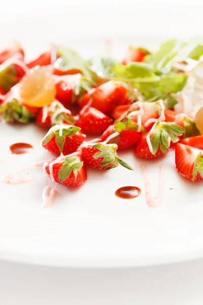 Strawberries with sweet sauce — Stock Photo, Image