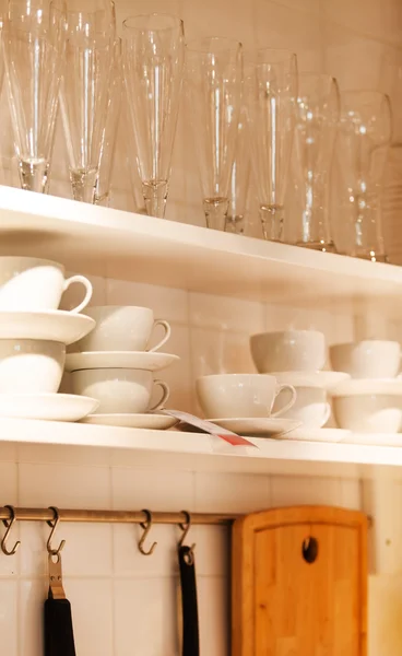 Kitchenware on wooden shelves — Stock Photo, Image