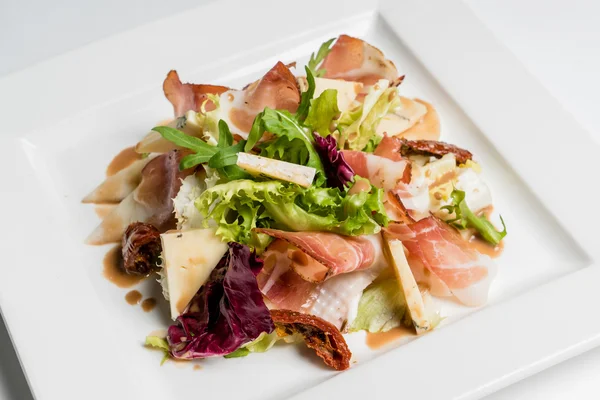 Salad with ham in plate — Stock Photo, Image