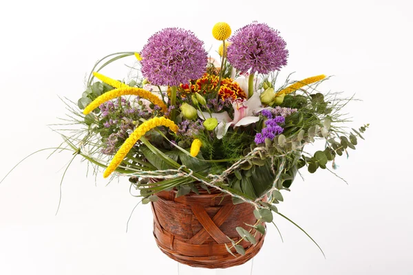 Flowers in brown basket — Stock Photo, Image
