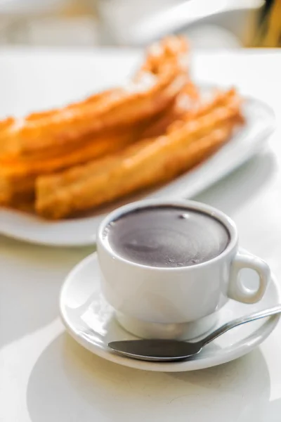 Churros con chocolate on plate — Stock Photo, Image