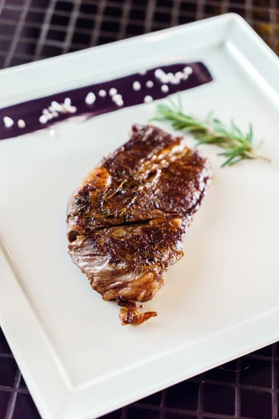 Tasty steak with sauce — Stock Photo, Image