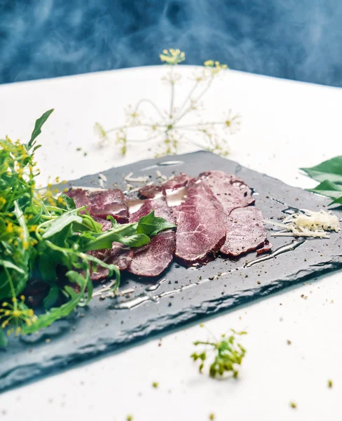 Beef carpaccio with herbs — Stock Photo, Image