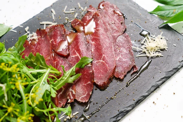 Beef carpaccio with herbs — Stock Photo, Image