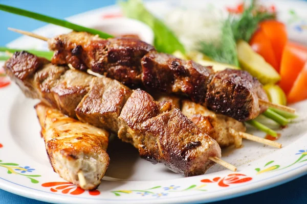 Grilled meat on spears — Stock Photo, Image