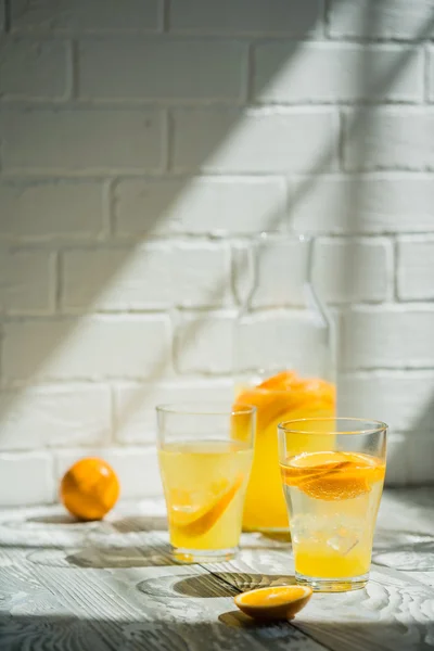 Orange lemonade in glasses — Stock Photo, Image