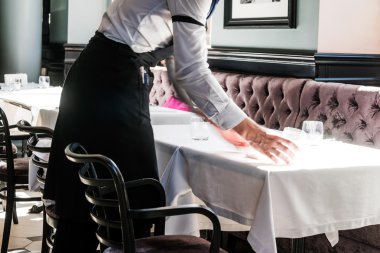waiter working in the restaurant clipart