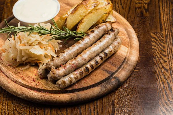 Grilled sausages with cabbage — Stock Photo, Image