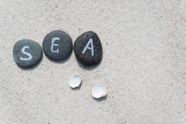 Pebble stones with lettering — Stock Photo, Image