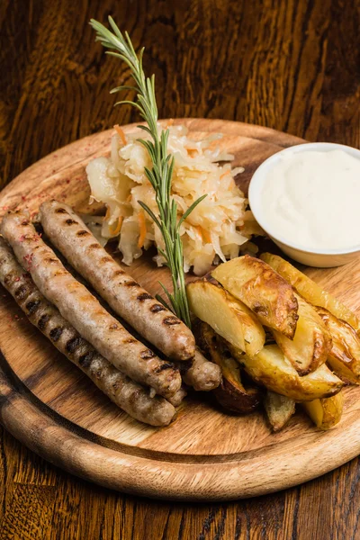 Grilled sausages with cabbage — Stock Photo, Image