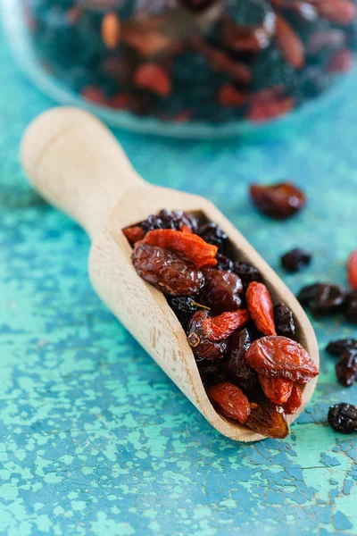 Dry berries in wooden scoop — Stock Photo, Image