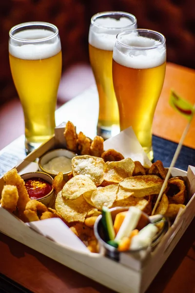 beer and snacks on table