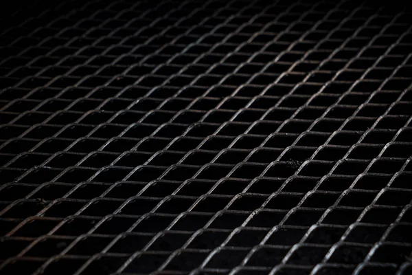 ブラックメタルグリルの背景クローズアップ — ストック写真