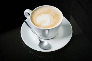 cup of cappuccino with milk heart