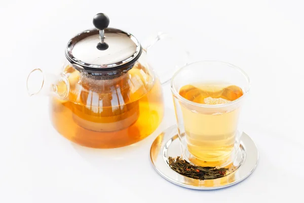 Green tea in teapot and glass — Stock Photo, Image