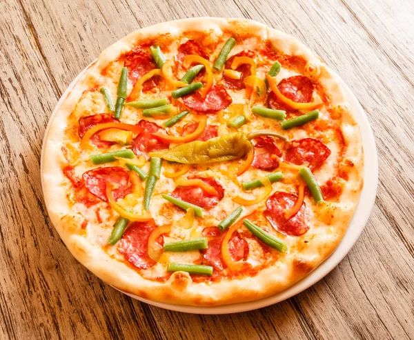 Pizza on plate — Stock Photo, Image