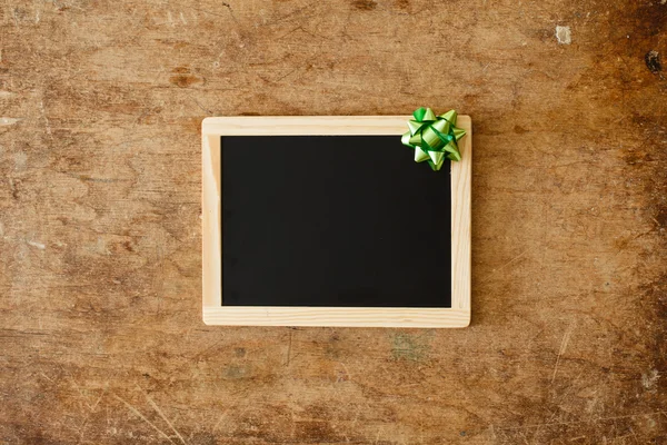 Wooden frame with bow — Stock Photo, Image