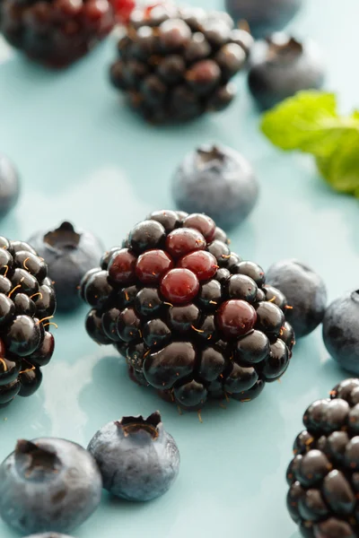 Fresh berries on blue — Stock Photo, Image