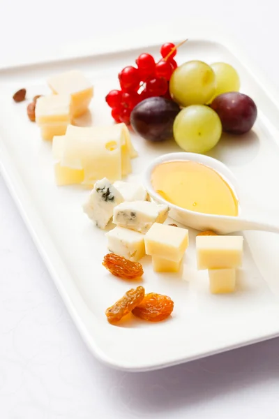 Cheese plate with sauce — Stock Photo, Image