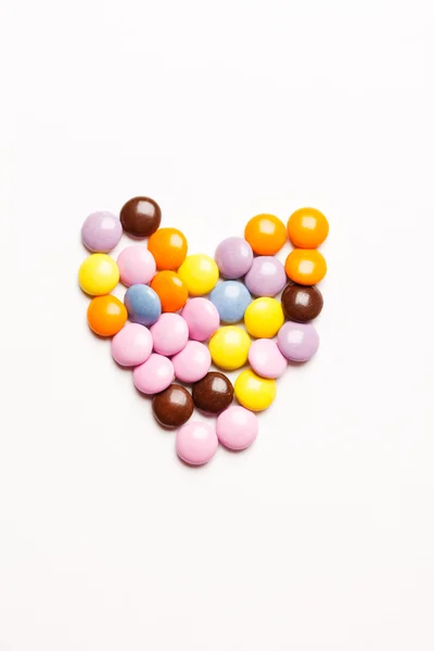 Heart made of multicolored candies — Stock Photo, Image