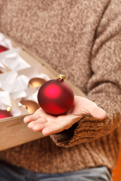 Christmas ball in the hand — Stock Photo, Image