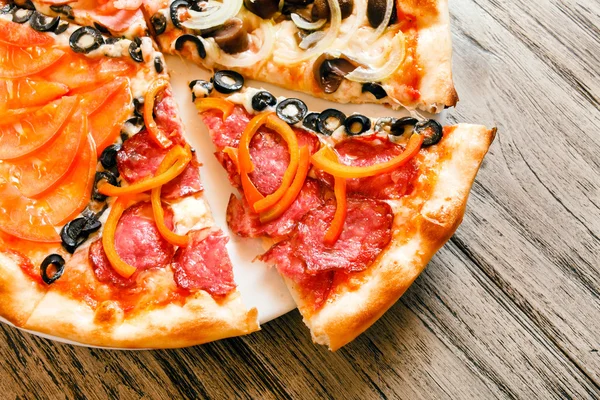 Sliced tasty pizza — Stock Photo, Image
