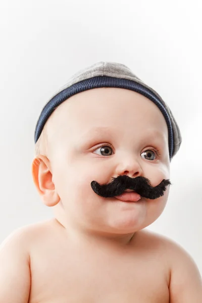 Söt baby med mustascher — Stockfoto