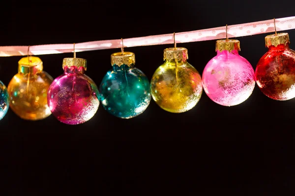 Christmas balls hanging on ribbon — Stock Photo, Image