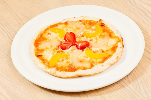 Sweet pizza on plate — Stock Photo, Image