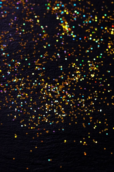 Glitter on black background — Stock Photo, Image