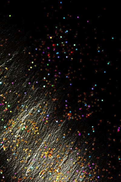 Glitter on black background — Stock Photo, Image