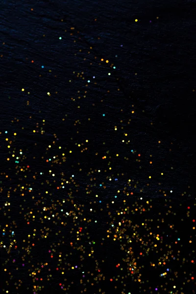 Glitter on black background — Stock Photo, Image