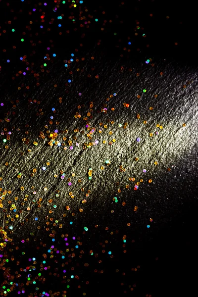 Glitter on black background — Stock Photo, Image