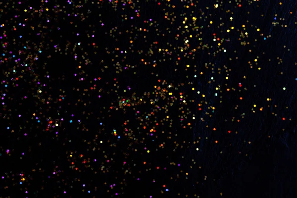 Glitter on black background — Stock Photo, Image