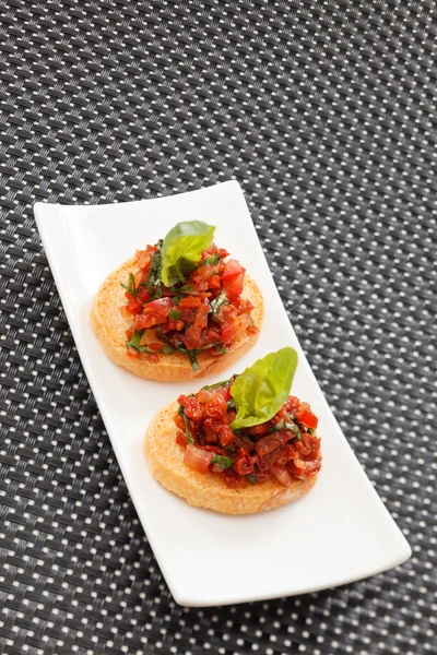 Tasty canapes on plate — Stock Photo, Image