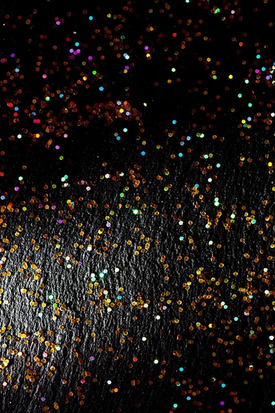 Glitter on black background — Stock Photo, Image