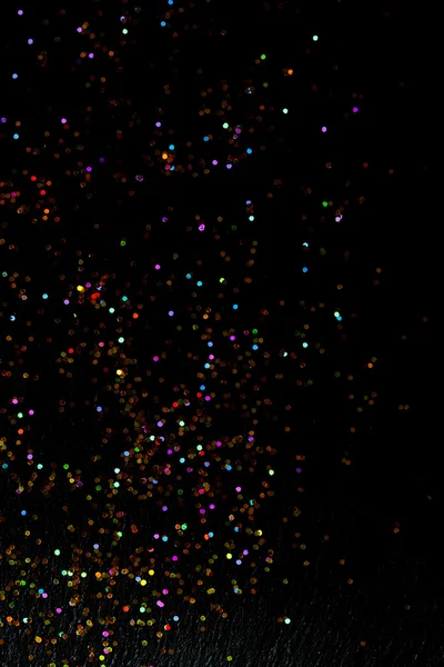 Glitter on black background — Stock Photo, Image