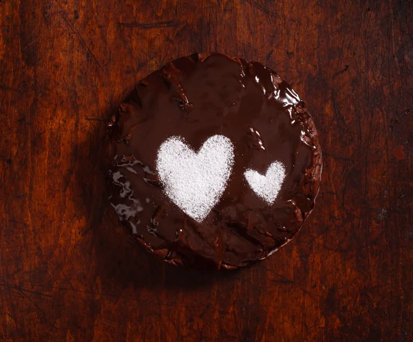 Chocolate cake with hearts — Stock Photo, Image