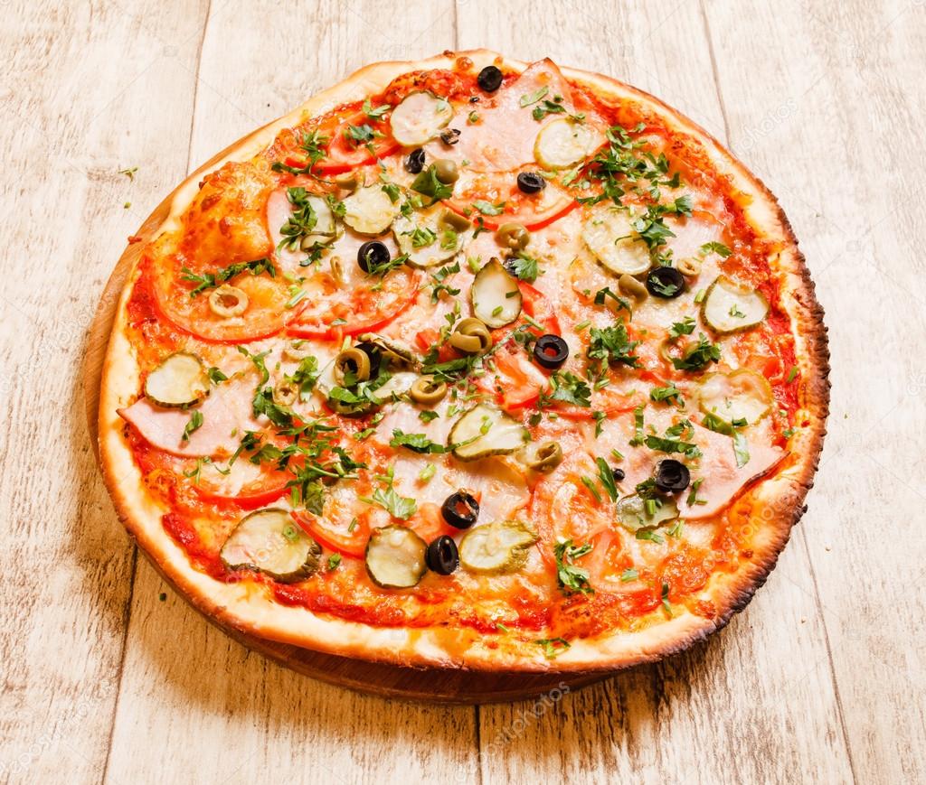Pizza with pickles Stock Photo by ©Shebeko 61772055