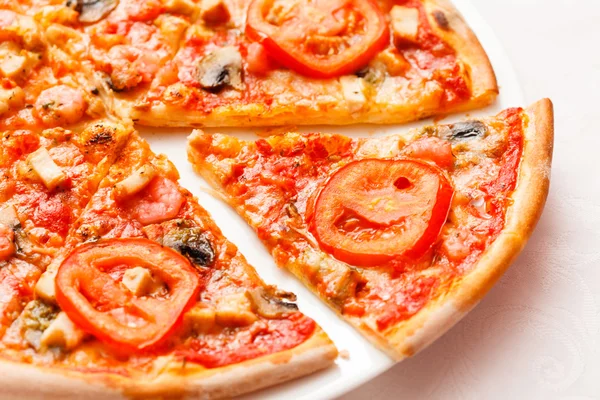 Sliced tasty pizza — Stock Photo, Image