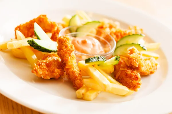 Chicken nuggets with french fries — Stock Photo, Image