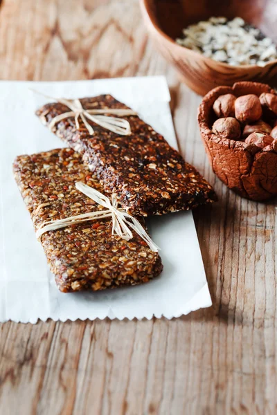 Granola bars on wooden table — Stock Photo, Image