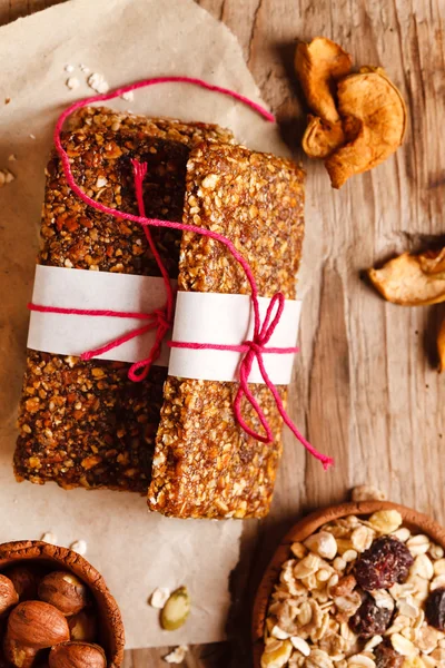 Granola bars on wooden table — Stock Photo, Image