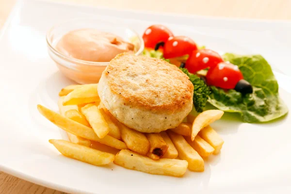 French fries with chicken cutlet — Stock Photo, Image